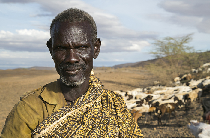 Herder seeks pasture for his goats during prolonged Kenya drought