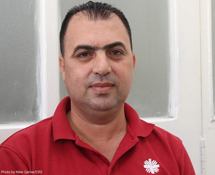 Syrian refugee Hassan Zoid owned his own business, but lost everything as war consumed his country. He volunteers helping other Syrian refugees, at a Caritas Jordan refugee center. CRS is assisting the Syrian people in transit all through the region.
