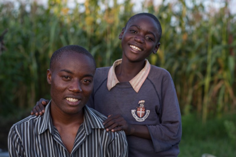 Felix and Levis Odhiambo lost their parents to complications from AIDS. Since age 13, Felix has been the main caregiver for his younger brother. Photo by Sara A. Fajardo/CRS