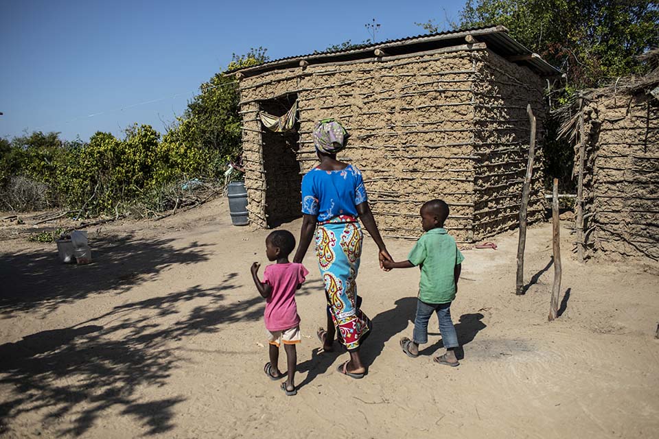 Kenya mother walks with her two children