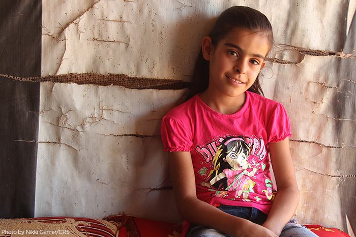 Syrian refugee Sakeena Mtier lives with her family of 11 in a shelter in Lebanon. Like many Syrian refugees, her family prays for peace and hopes to return home. CRS is assisting the Syrian people in transit all through the region.