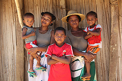 Madagascar moms Helene Baotlata, left, and Victorine Minoarison, in hat, teamed up to help their children recover after a monthly weigh-in showed they were undernourished. Photo by Sara A. Fajardo/CRS