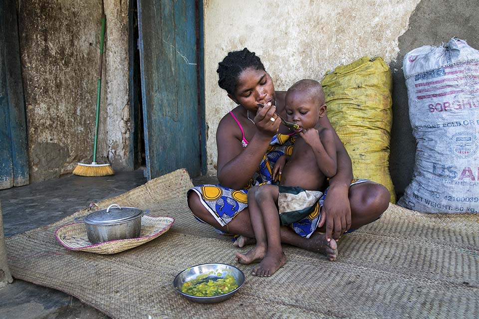Madagascar mom feeds her child