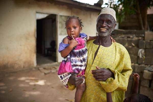 man with granddaughter in The Gambia