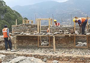 masons at work on a new house in Nepal