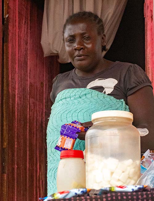 woman in Cameroon with household goods