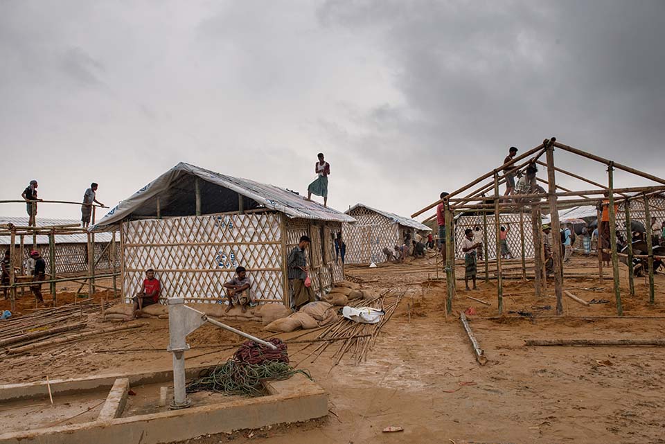 workers build shelters in a Rohingya refugee camp in Bangladesh