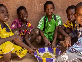 Little boys from Mali have lunch at school