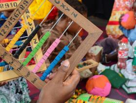Parents learn to make toys for their children as part of CRS' THRIVE program. Photo by Philip Laubner