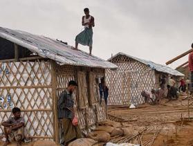 workers build shelters in a Bangladesh camp for Rohingya refugees